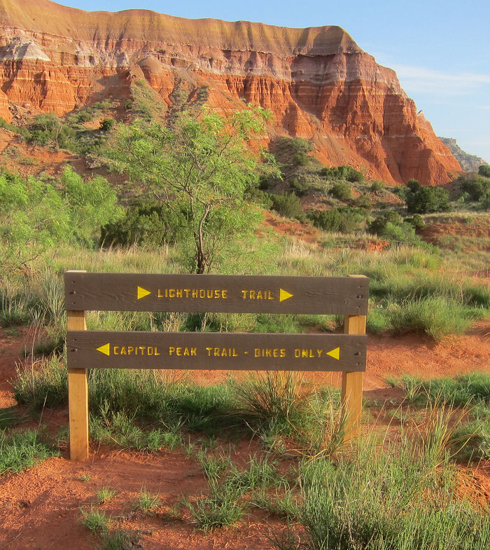 Wooden trail sign along Lighthouse Trail in Palo Duro Canyon State Park. 