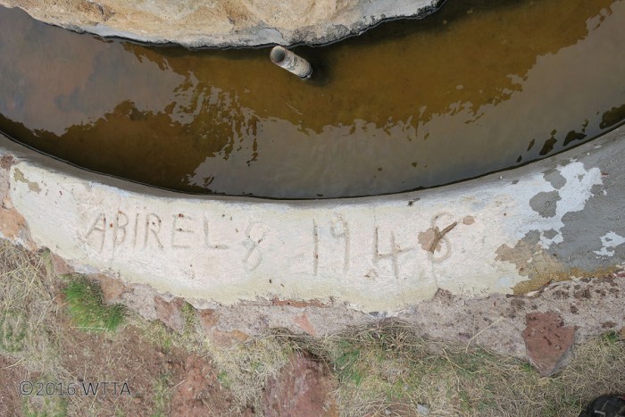 Signature date carved into the well. 